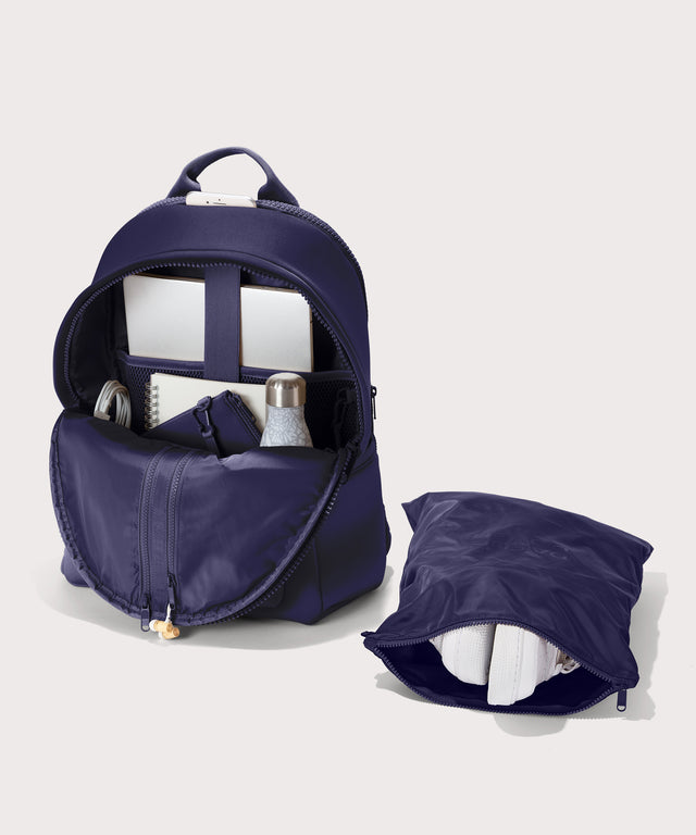 Large Dakota in a jewel-toned, deep blue with strong purple undertones. unzipped, top down view. 
