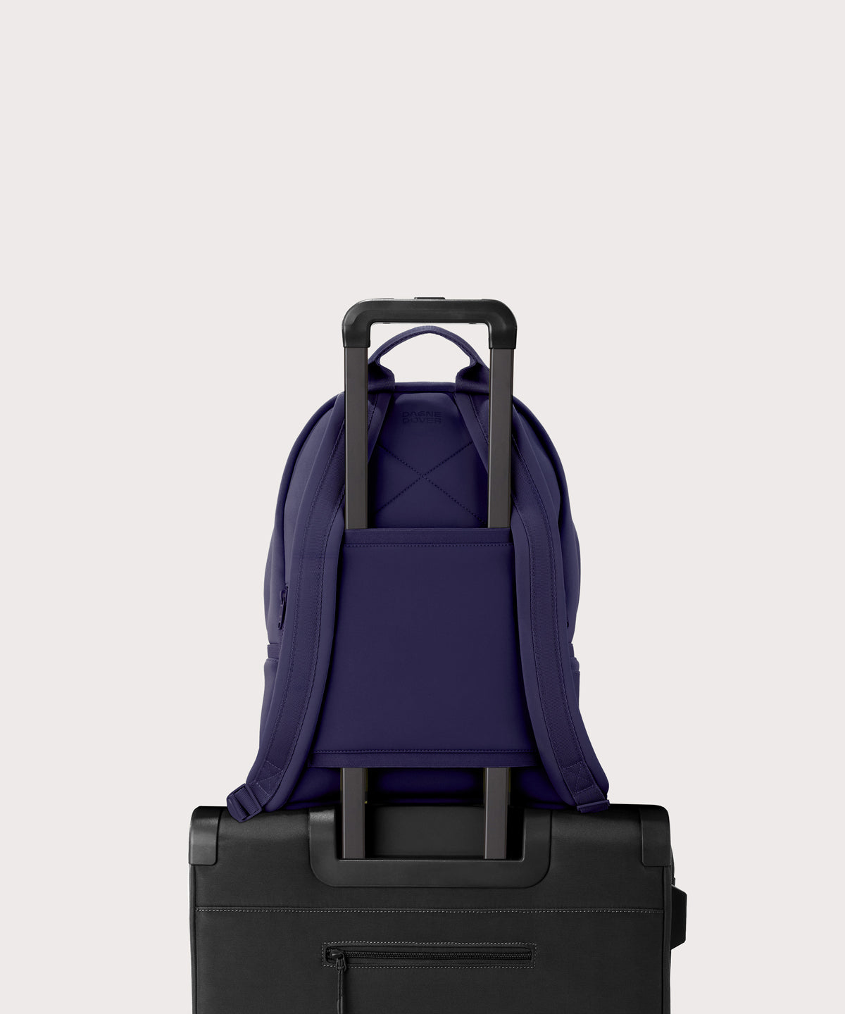 Medium Dakota in a jewel-toned, deep blue with strong purple undertones. displaying luggage sleeve
