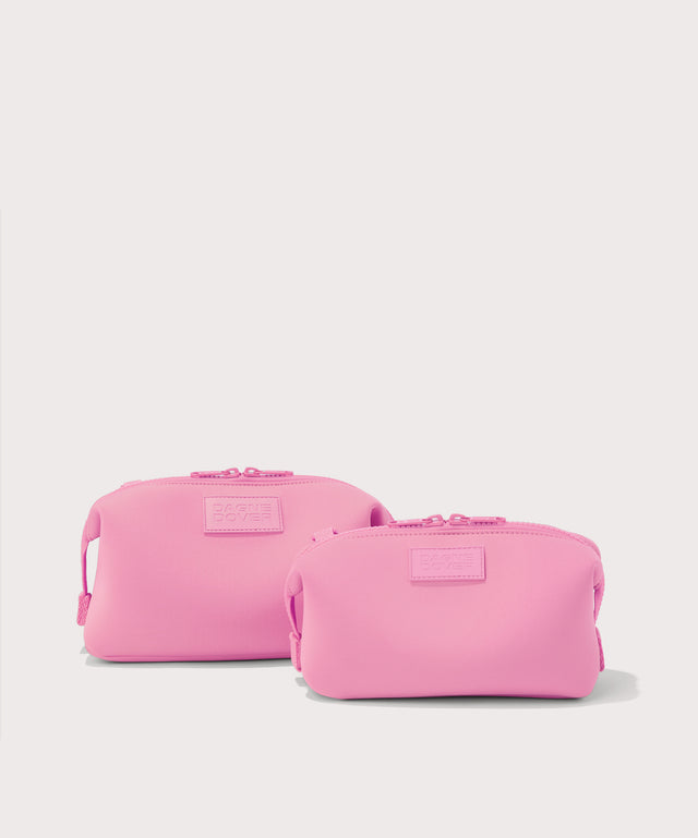 Dagne Dover Small and Large Hunter Toiletry Bags in a true bubble gum pink.