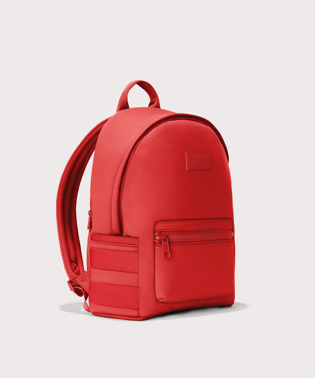 Dagne Dover Medium Dakota Backpack in a fiery, saturated red leaning toward orange seen from an angle.