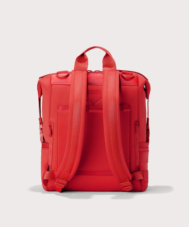 Dagne Dover Large Indi Diaper Backpack in a fiery, saturated red leaning toward orange seen from the back.