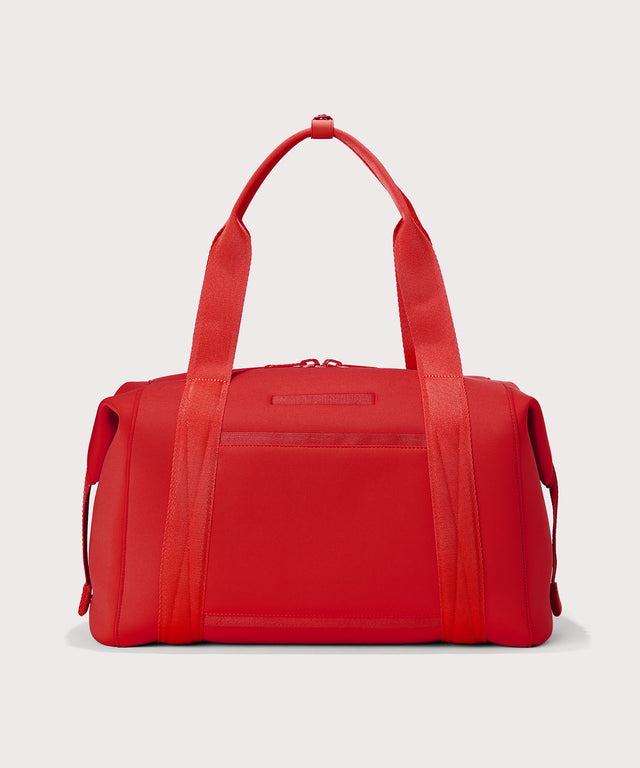 Dagne Dover Large Landon Carryall in a fiery, saturated red leaning toward orange seen from the back.