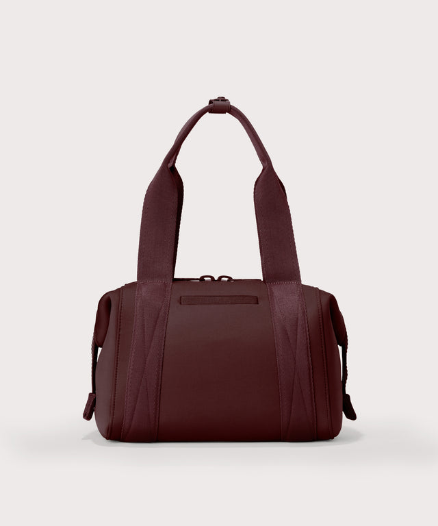 Dagne Dover Small Landon Carryall in a deep brown with purple undertones seen from the back.