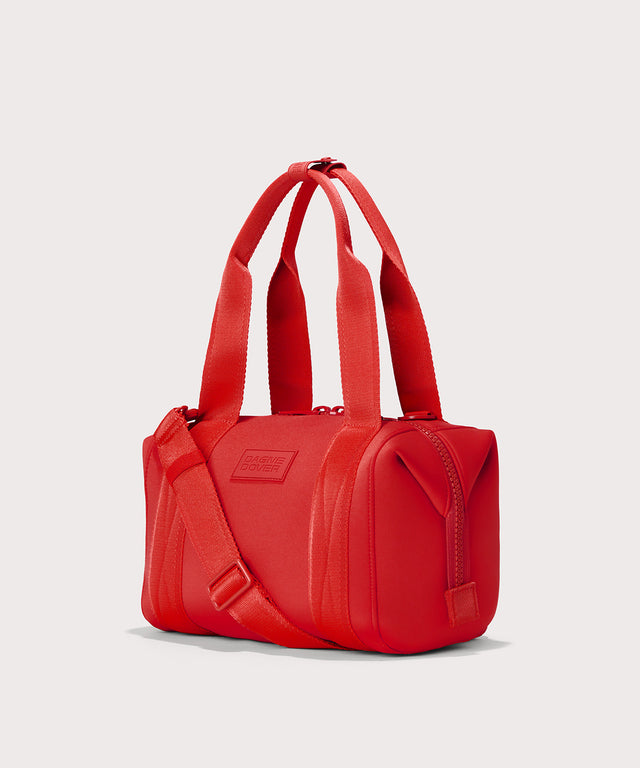 Dagne Dover Small Landon Carryall in a fiery, saturated red leaning toward orange seen from an angle.