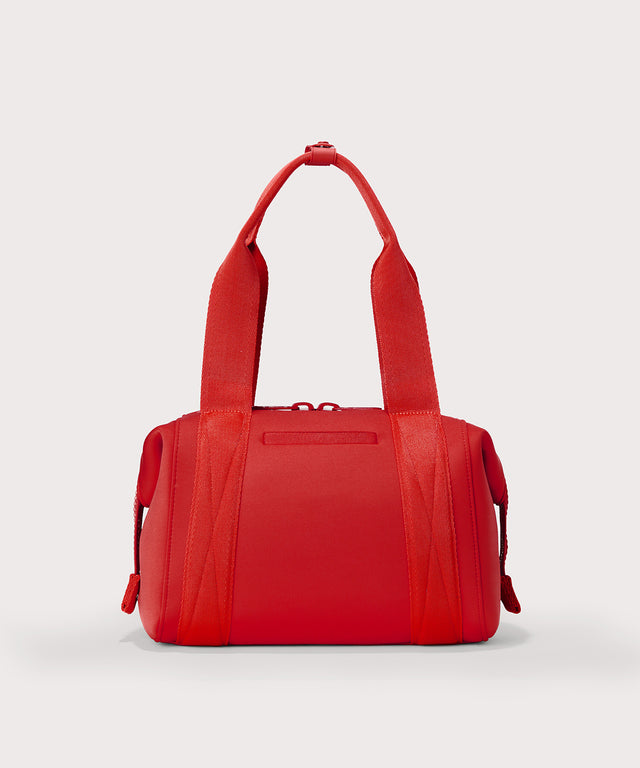 Dagne Dover Small Landon Carryall in a fiery, saturated red leaning toward orange seen from the back.