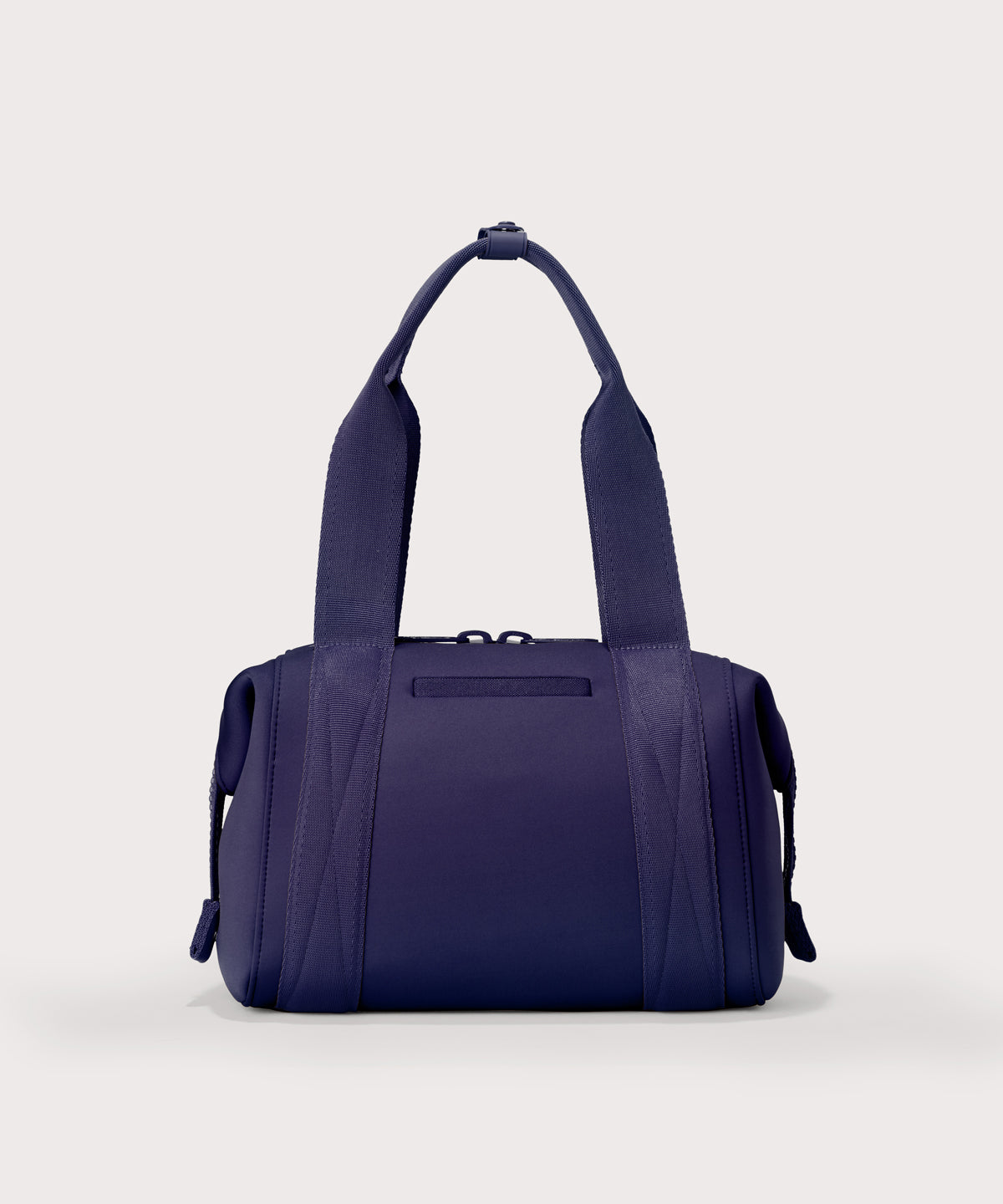 Small Landon Carryall in a jewel-toned, deep blue with strong purple undertones, displaying an exterior phone pocket
