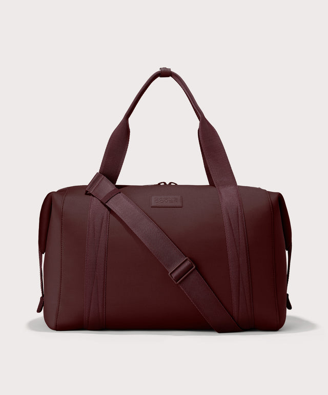 Dagne Dover Extra Large Landon Carryall in a deep brown with purple undertones.