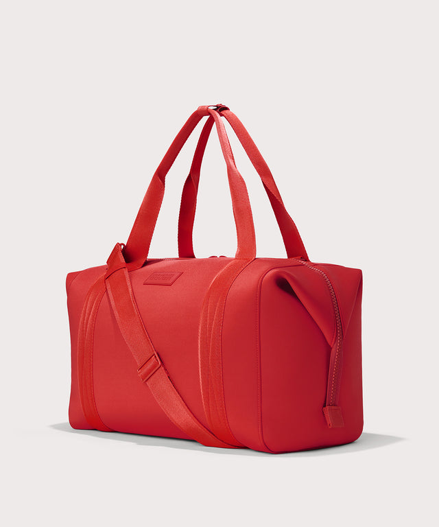 Dagne Dover Extra Large Landon Carryall in a fiery, saturated red leaning toward orange seen from an angle.