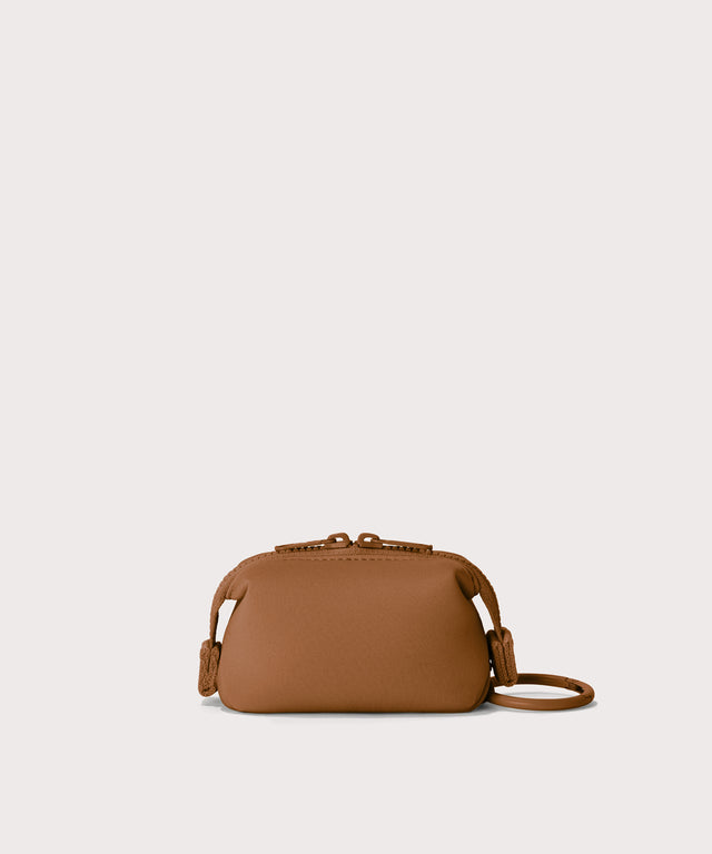 Hunter keychain in a saturated, warm medium-brown with burnt orange undertones Back view. 
