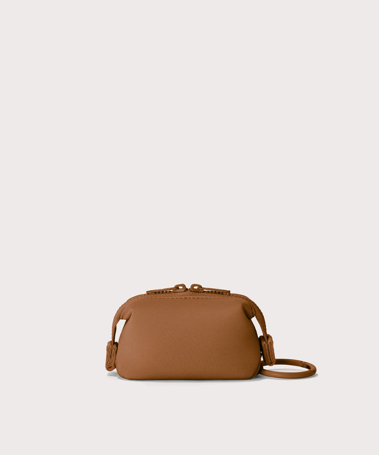 Hunter keychain in a saturated, warm medium-brown with burnt orange undertones Back view. 
