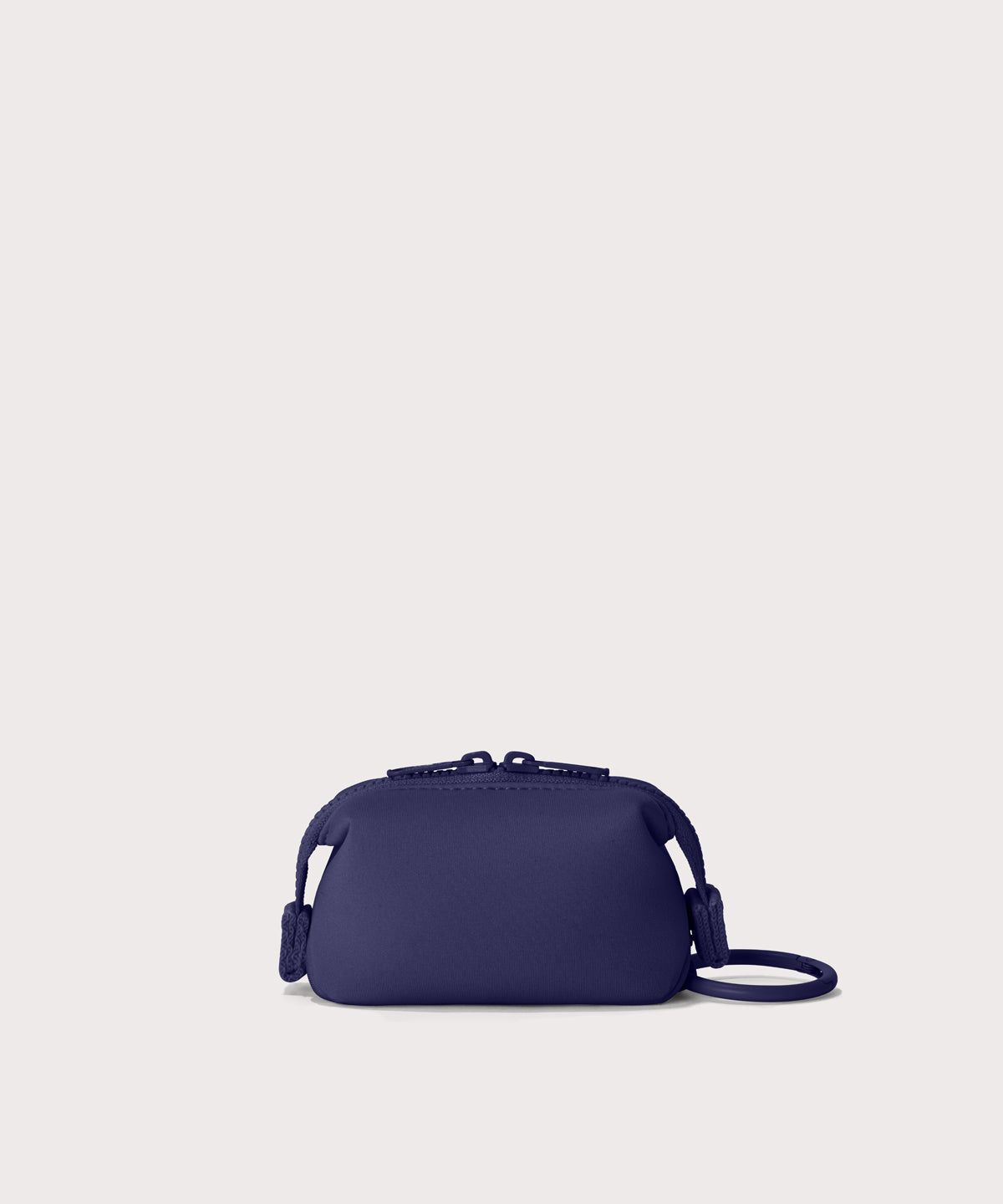 Hunter keychain in a jewel-toned, deep blue with strong purple undertones.  Back view. 
