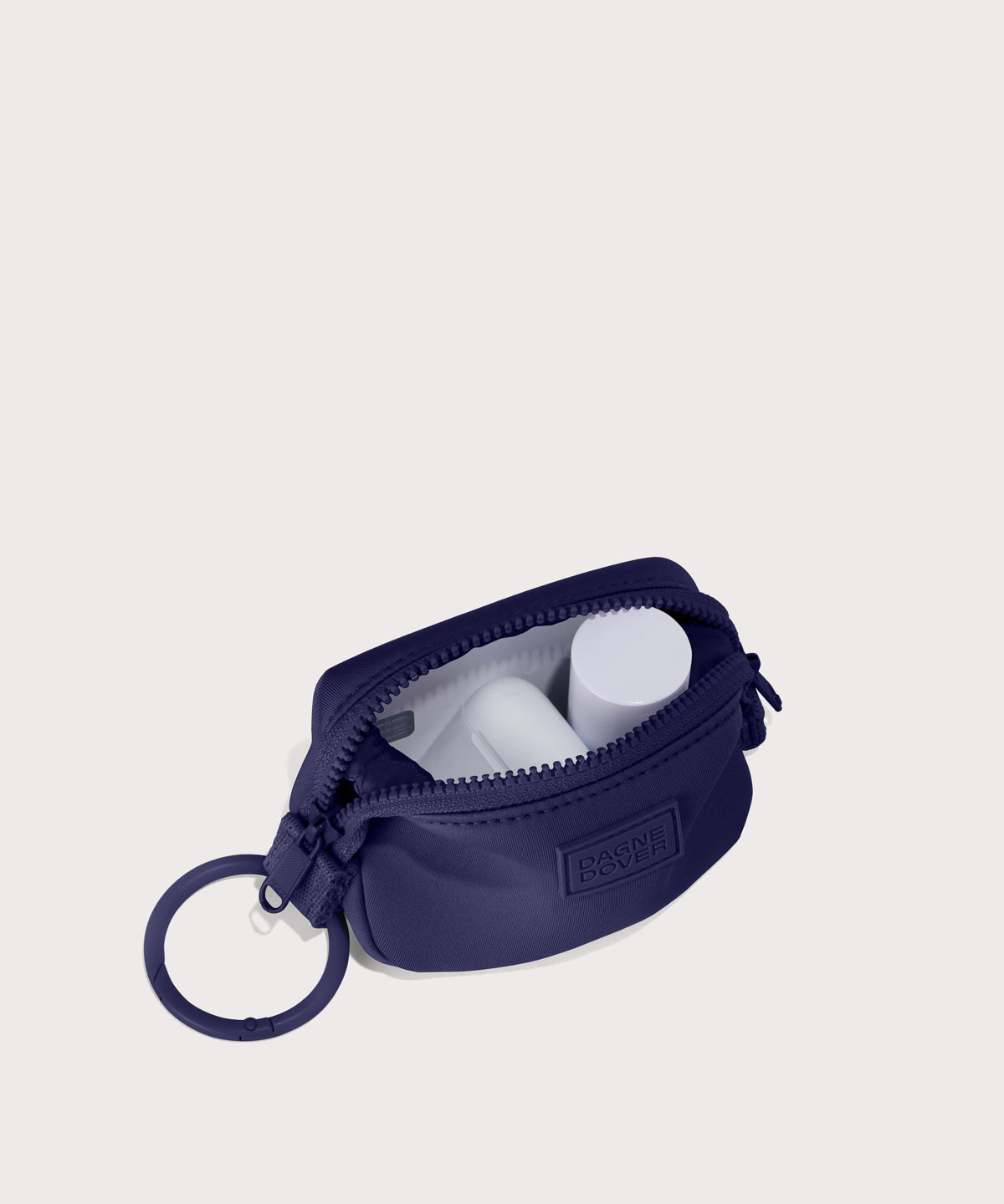 Hunter keychain in a jewel-toned, deep blue with strong purple undertones. . unzipped, top down view. 
