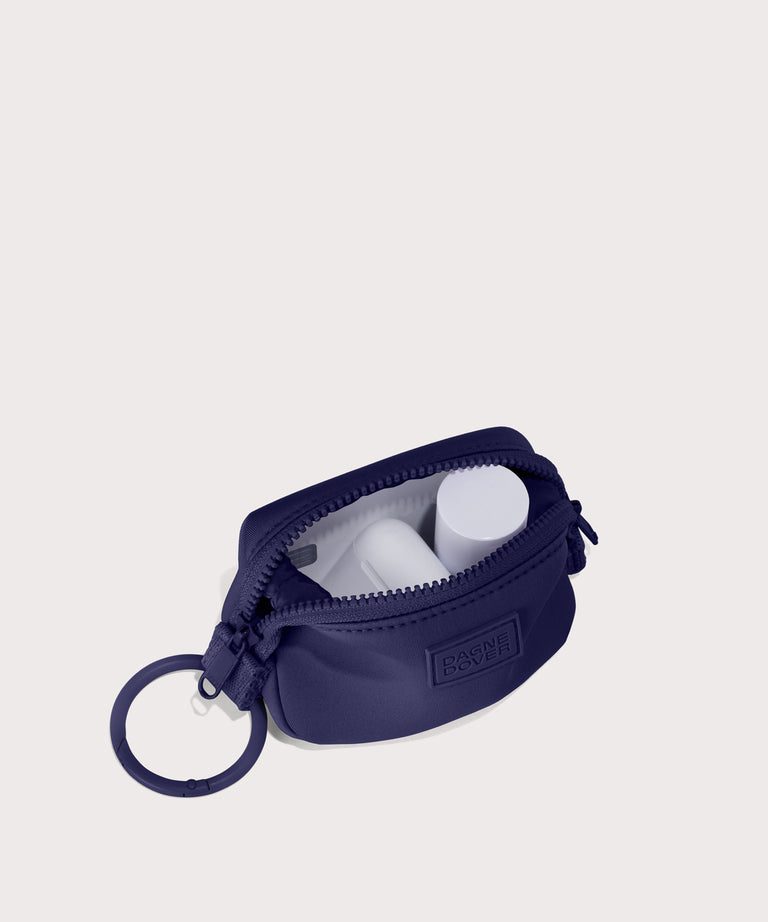Hunter keychain in a jewel-toned, deep blue with strong purple undertones. . unzipped, top down view. 
