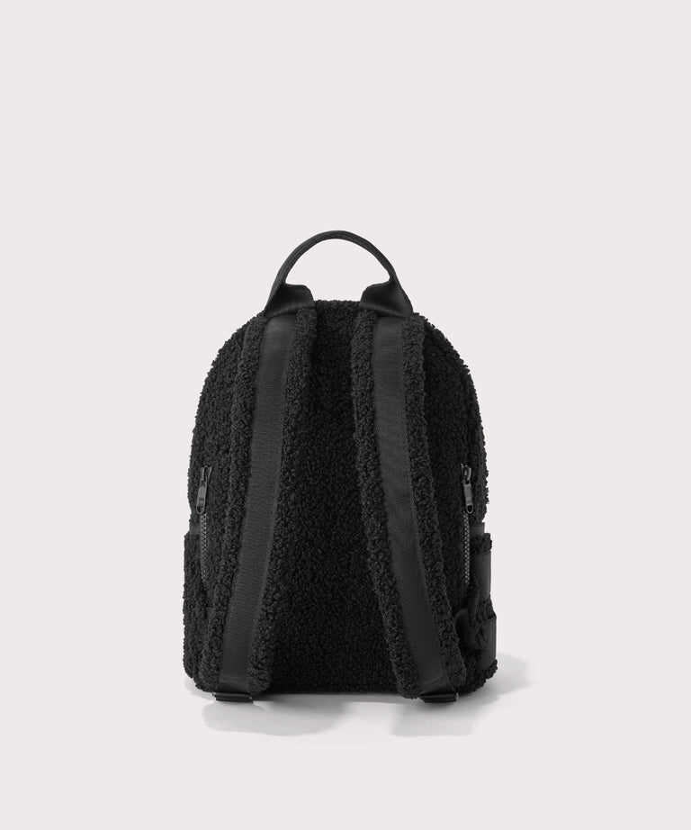 Dakota Small backpack pack in a black  Back view.  In a  Faux Shearling  a soft, wool-like plush made with recycled materials
