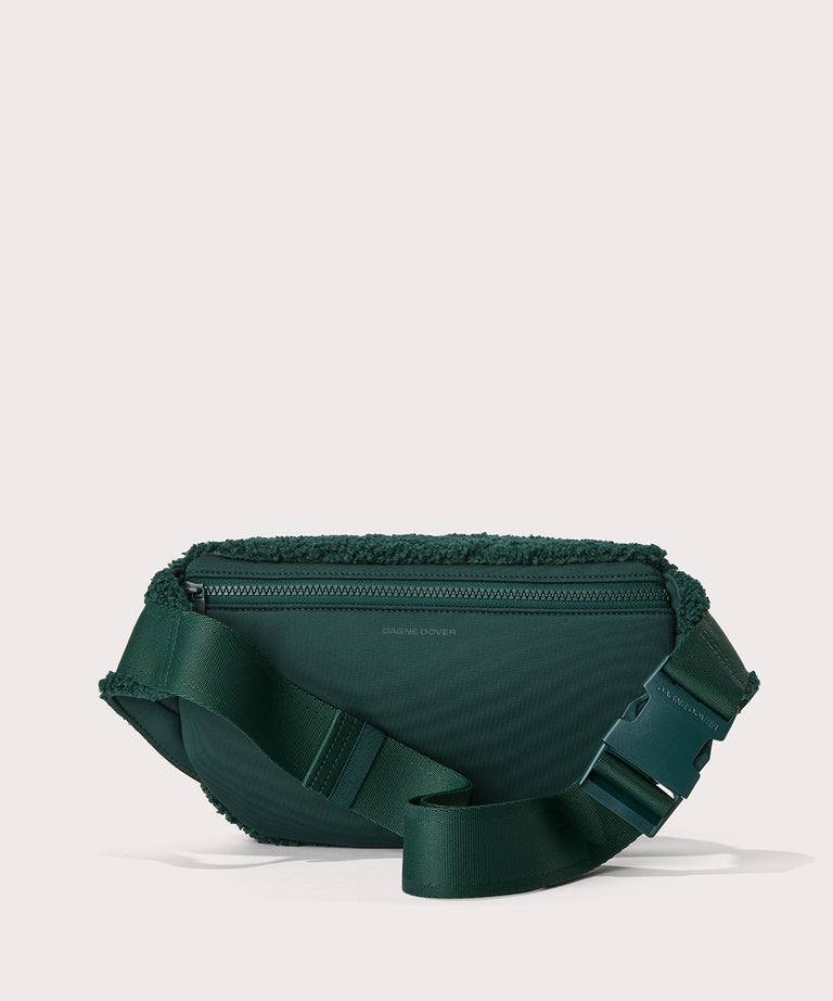 Jax fanny pack in a saturated, jewel-toned deep green with bold blue undertones. Back View. In a  Faux Shearling  a soft, wool-like plush made with recycled materials

