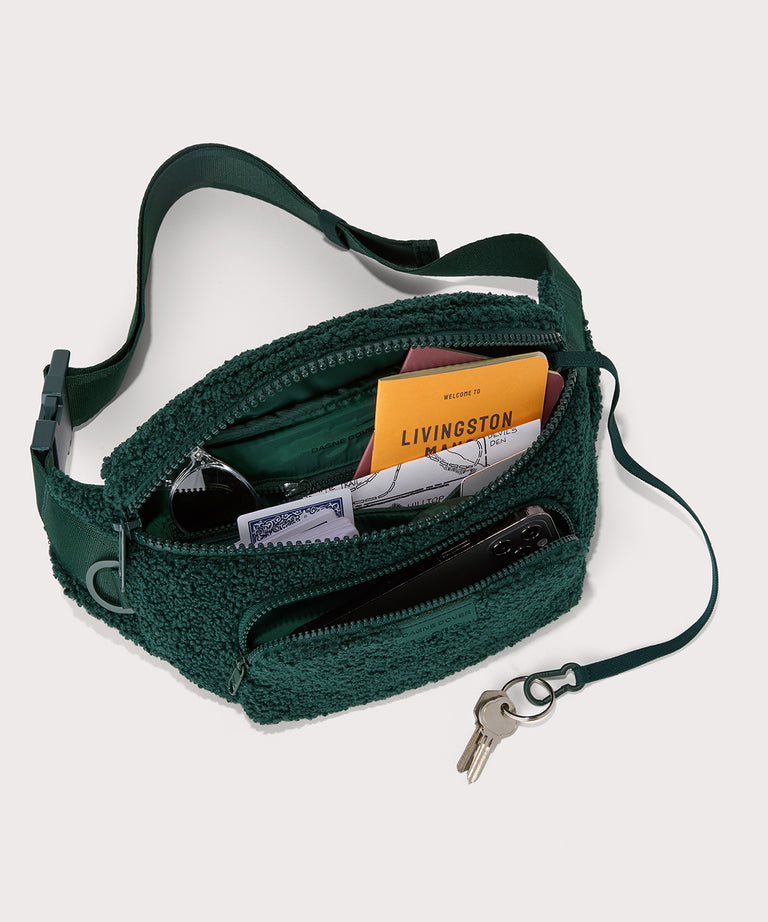Jax fanny pack in a saturated, jewel-toned deep green with bold blue undertones. Top down view. In a  Faux Shearling  a soft, wool-like plush made with recycled materials
