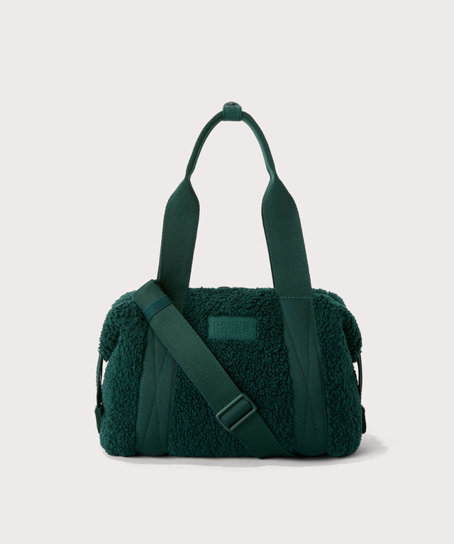 small landon carryall in a saturated, jewel-toned deep green with bold blue undertones. In a  Faux Shearling  a soft, wool-like plush made with recycled materials
