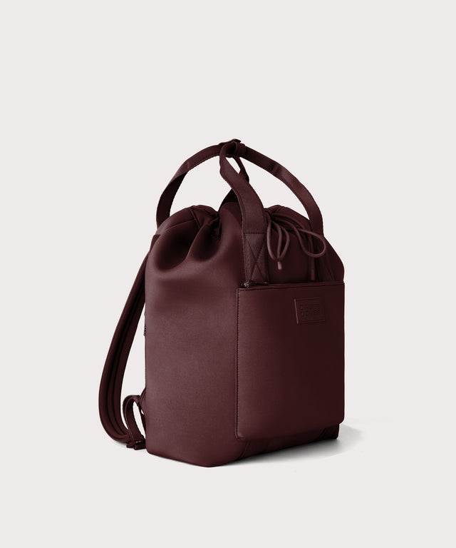 Rhys Backpack in a deep brown with purple undertones seen from an angle.