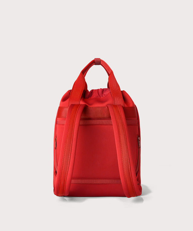 Dagne Dover Rhys Backpack in a fiery, saturated red leaning toward orange seen from the back.