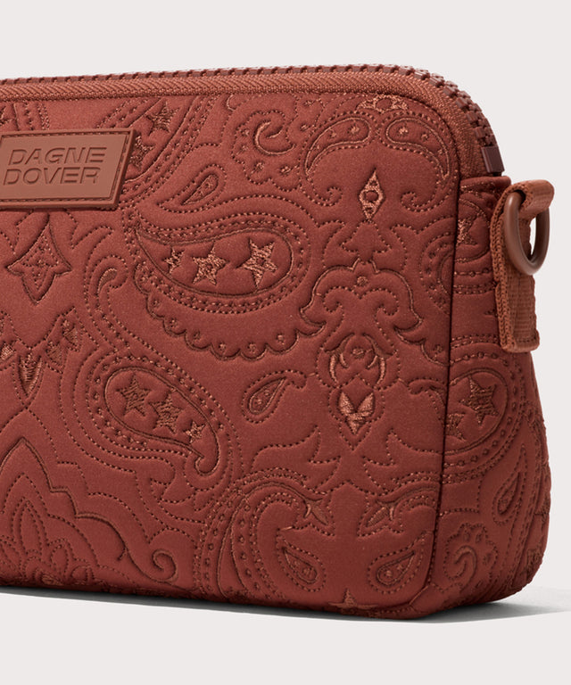 Dagne Dover Nora Shoulder Bag in a rich, warm brown with an embroidered paisley print seen up close, showcasing the pattern.