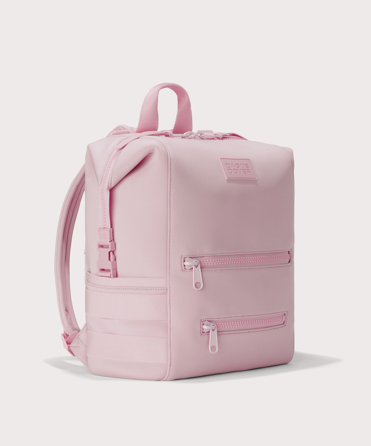 Large Indi backpack in a cool, powdery pink with soft grey undertones, side angle view

