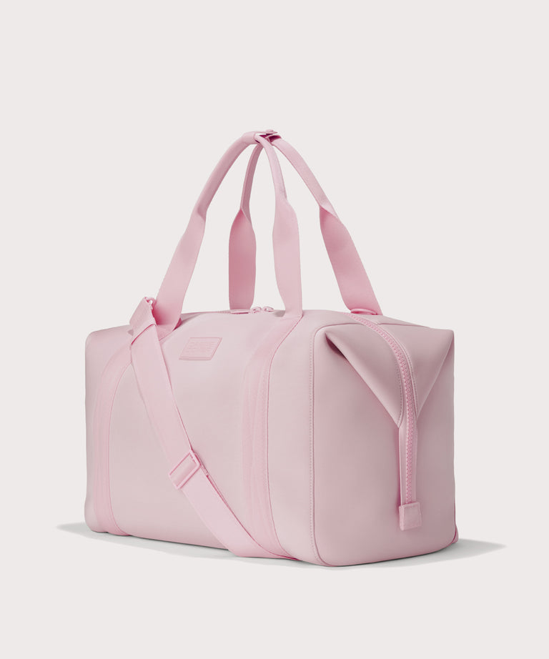 Extra large Landon Carryall in a cool, powdery pink with soft grey undertones, angle view

