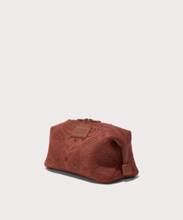 Dagne Dover Large Hunter Toiletry Bag in a rich, warm brown with an embroidered paisley print seen from an angle.