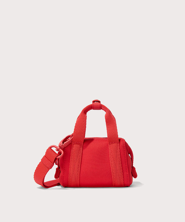 Dagne Dover Micro Landon Crossbody in a fiery, saturated red leaning toward orange seen from the back.