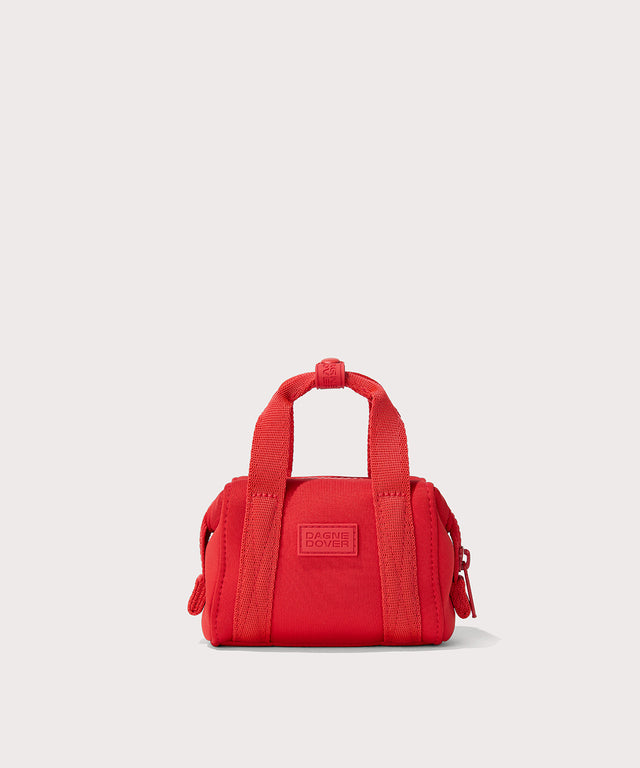 Dagne Dover Micro Landon Crossbody in a fiery, saturated red leaning toward orange with the crossbody strap unclipped.