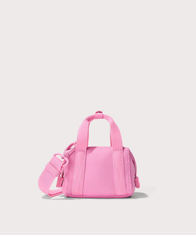 Dagne Dover Micro Landon Crossbody in a true bubble gum pink seen from the back.