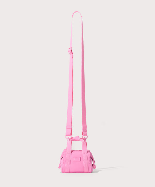Dagne Dover Micro Landon Crossbody in a true bubble gum pink with the crossbody strap up.