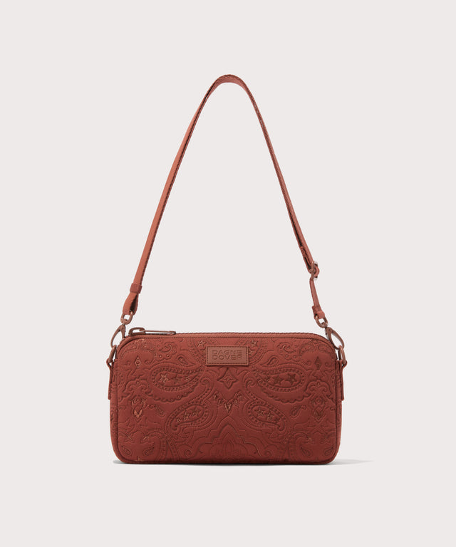 Dagne Dover Nora Shoulder Bag in a rich, warm brown with an embroidered paisley print with the crossbody strap displayed.