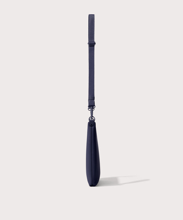 14 inch laptop shoulder bag in navy blue  seen from the side view .