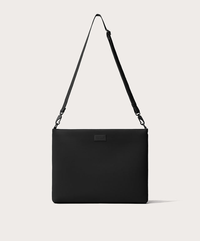 16 inch laptop shoulder bag in a black seen from the front view. 
