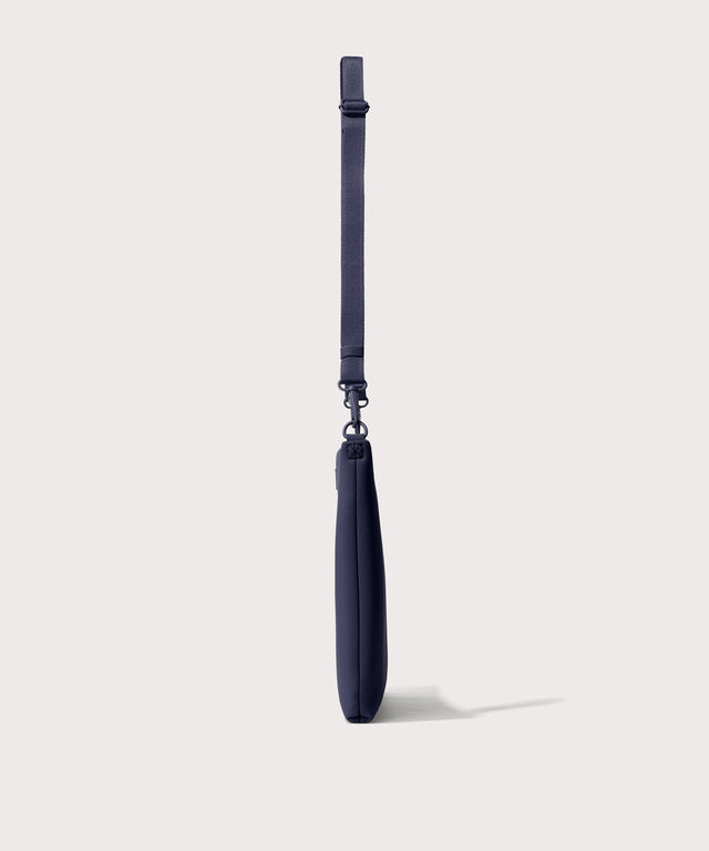 16 inch laptop shoulder bag in navy blue  seen from the side view.