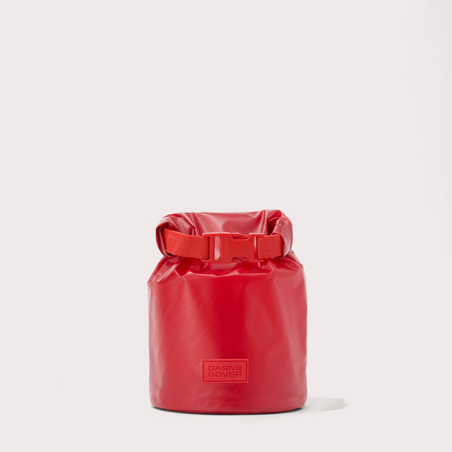 Dagne Dover Rae Roll-Top Dry Bag in a fiery, saturated red leaning toward orange.