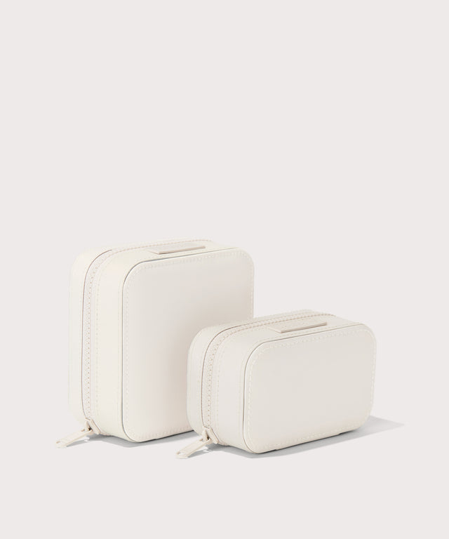 Dagne Dover Small and Large Frankie Jewelry Cases in white standing next to one another.
