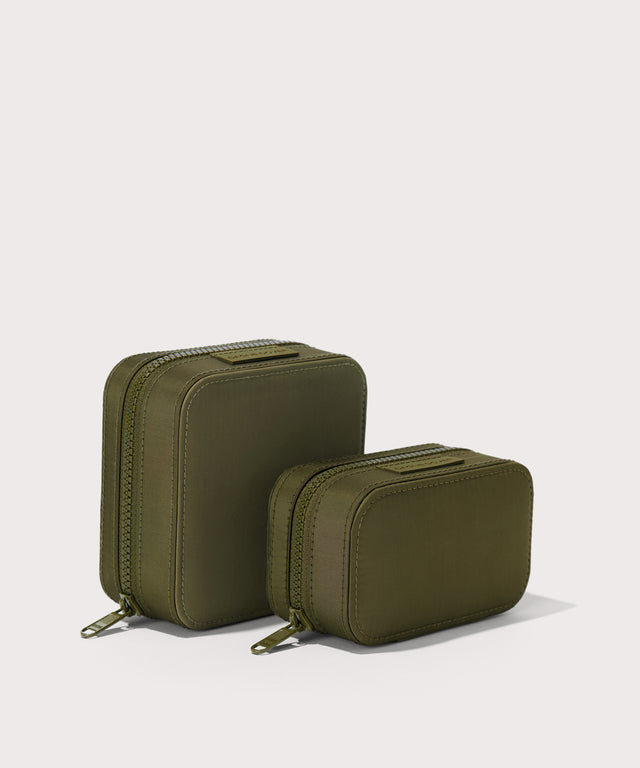 Dagne Dover Small and small Frankie Jewelry Cases in dark green standing next to one another.
