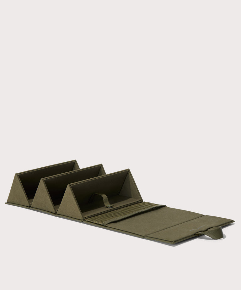 Dagne Dover Remi foldable glasses holder in dark green, unfolded.
