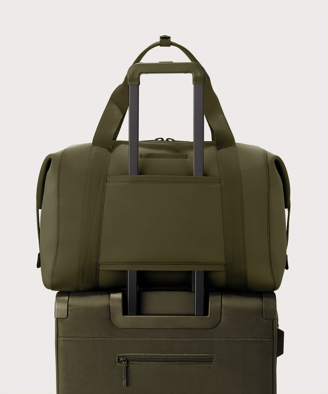 Extra large Landon Carryall in dark green displaying luggage sleeve
