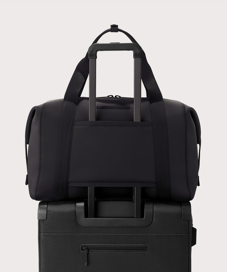 Extra large Landon Carryall in dark green displaying luggage sleeve
