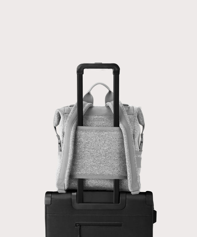 Dagne Dover medium Indi Diaper Backpack in grey showing the neoprene luggage sleeve.
