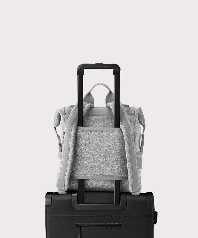 Dagne Dover medium Indi Diaper Backpack in grey showing the neoprene luggage sleeve.
