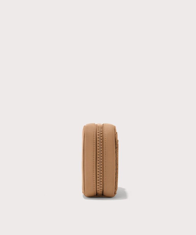Dagne Dover small Arlo Tech Organizer in camel seen from the side.