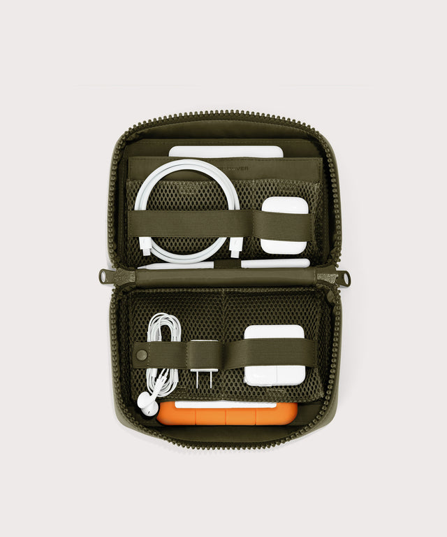 hover - Dagne Dover large Arlo Tech Organizer in dark green unzipped, revealing the interior elastic loops and airmesh pockets.