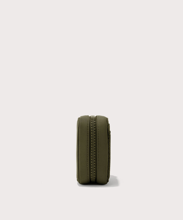 Dagne Dover small Arlo Tech Organizer in dark green seen from the side.
