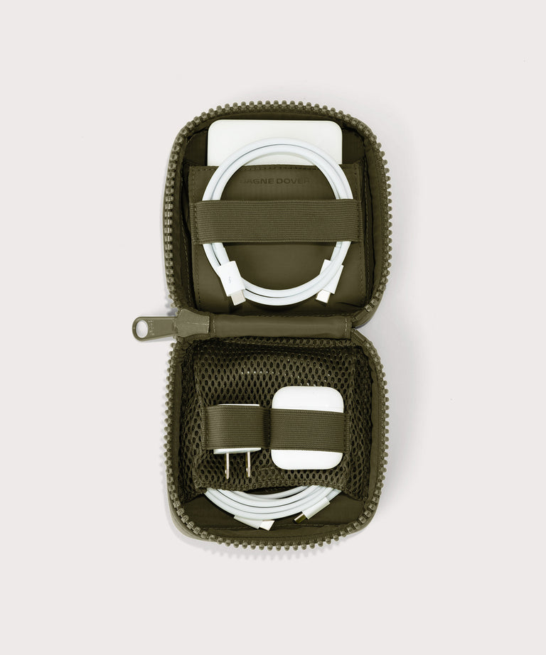 hover - Dagne Dover small Arlo Tech Organizer in dark green unzipped, revealing the interior elastic loops and airmesh pockets.