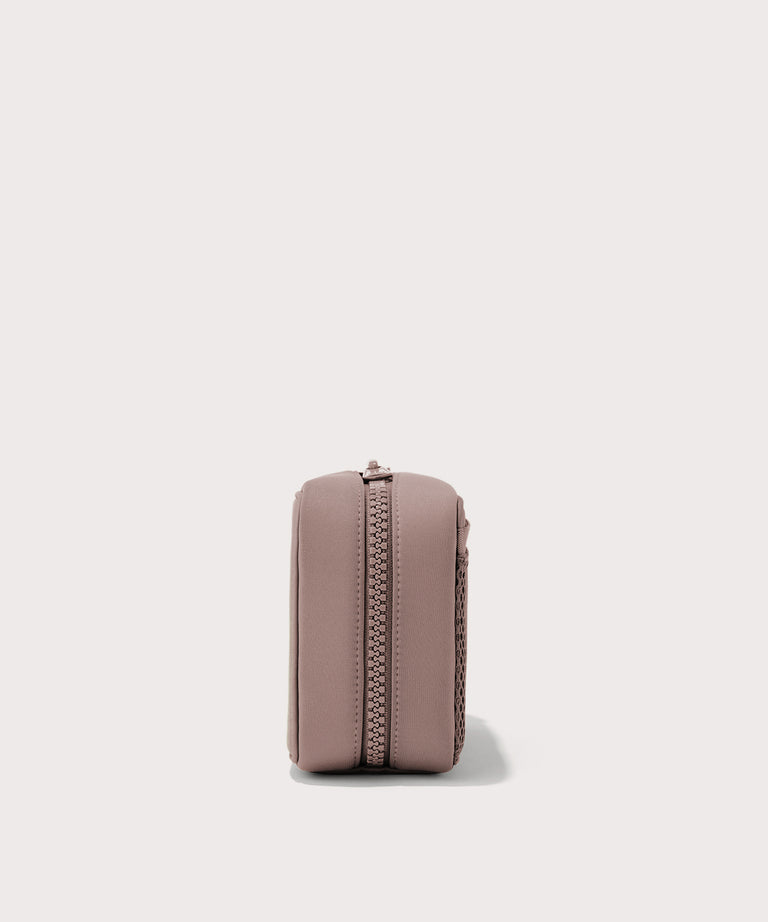 Dagne Dover large Arlo Tech Organizer in pink seen from the side.
