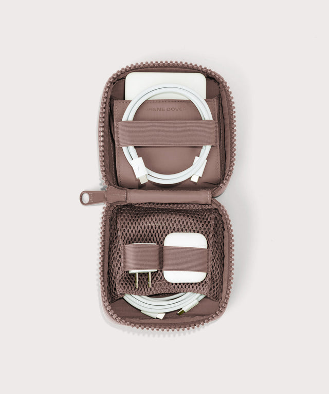 hover - Dagne Dover small Arlo Tech Organizer in pink unzipped, revealing the interior elastic loops and airmesh pockets.