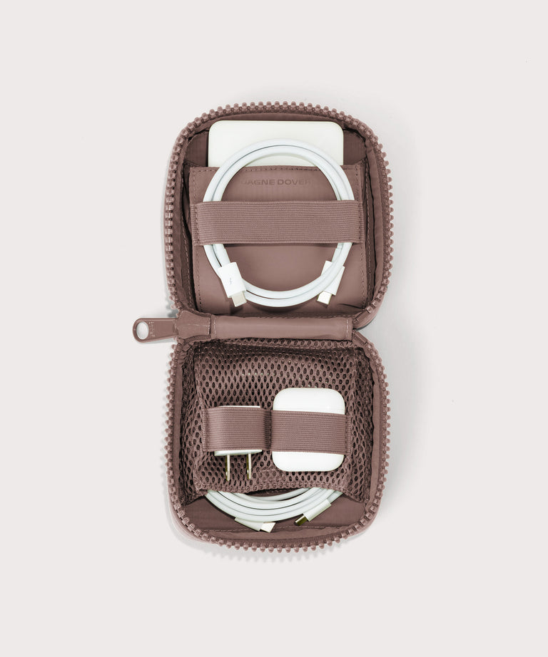 hover - Dagne Dover small Arlo Tech Organizer in pink unzipped, revealing the interior elastic loops and airmesh pockets.